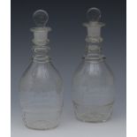 A pair of mallet shaped decanters, triple ring necks, etched with scrolling vine, 23cm high, c.