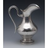 A large 19th century French helmet shaped ewer, engine turned and engraved with bands of Greek key,