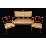 A Victorian mahogany three-piece salon suite, comprising a sofa and a pair of chairs,