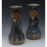 A near pair of Royal Doulton baluster vases, designed by Ethel Beard and W.