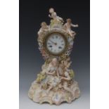 A Continental porcelain figural clock, the 9cm white enamelled dial with Roman numerals,