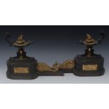 A pair of 19th century French bronze and ormolu chenets, in the Etruscan style,