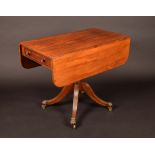 A George IV mahogany rounded rectangular Pembroke table, reeded top above a cockbeaded drawers,
