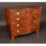 A George III mahogany serpentine fronted chest, of four long graduated cockbeaded drawers,