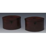 A pair of late 18th/early 19th century mahogany and brass marquetry navette shaped tea caddies,