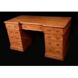 A Victorian pollard oak twin pedestal desk,