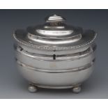 A George III silver boat shaped tea caddy, rounded rectangular knop finial,