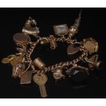 A yellow gold solid link charm bracelet, stamped 18ct to end link,