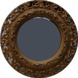 A 19th century circular giltwood mirror, the frame pierced acanthus scrolls, 61cm diam, c.