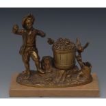 A 19th century French gilt bronze figural inkwell, cast as a young man picking grapes, he stands,