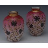 A pair of English opaque glass ovoid vase, decorated in gilt with flowerheads and foliage,