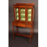 A Sheraton Revival mahogany breakfront salon display cabinet, of small proportions,