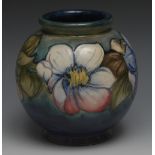 A Moorcroft Clematis pattern globular vase, tube lined with large flowerheads and foliage,