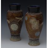 A pair of Doulton Lambeth inverted baluster vases,