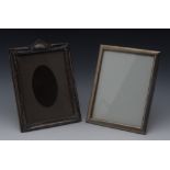 A George V silver rectangular easel photograph frame, embossed with trailing flowers,
