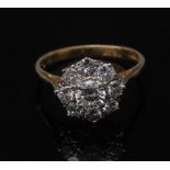 A diamond flowerhead cluster ring,