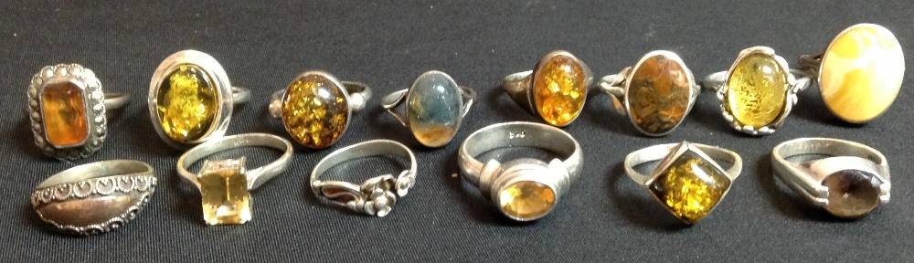 A moss agate cabochon ring, silver shank;  a simulated citrine pale yellow dress ring,