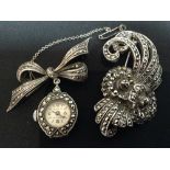 A Repa silver and marcasite ribbon tied nurse's fob watch;