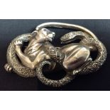 An Art Deco continental silver brooch as a panther fighting a snake, encrusted with marcasite,