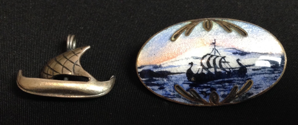 A Norwegian silver and enamelled brooch, painted and enamelled with a long ship at sail,