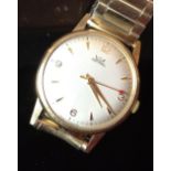 A gentleman's Smith Astral 9ct gold wristwatch, silvered dial, Arabic numerals at 3,6,9,12 o'clock,