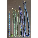 A lapis lazuli graduated globular bead necklace, spring clasp;  another,