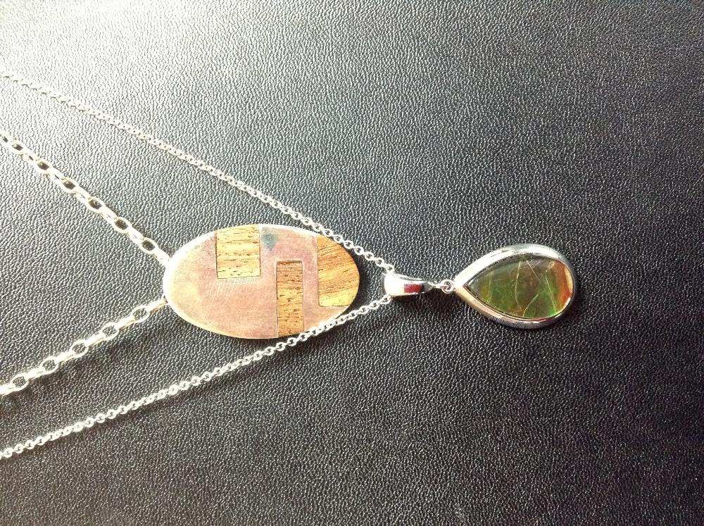 A Canadian Aurora silver and ammolite teardrop pendant necklace, boxed;  another,