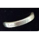 A Tiffany & Co silver ring, the exterior marked Tiffany & Co.