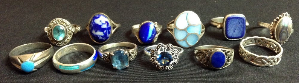 A Fusion aqua and royal blue enamelled silver ring;  a Celtic band ring;  others including abalone,