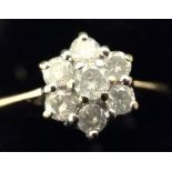 A diamond flower head cluster ring,