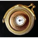An unusual gold coloured metal shirt/collar stud watch, white enamel dial, Arabic numerals,