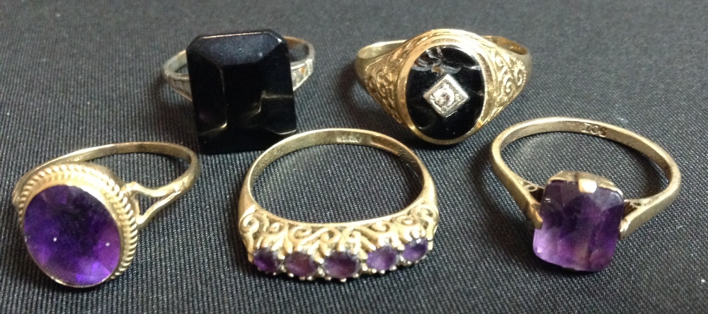 An oval single stone amethyst and 9ct gold dress ring;  another,