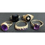 An oval single stone amethyst and 9ct gold dress ring;  another,