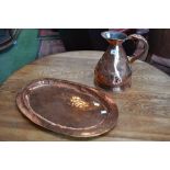 A copper Haystack jug and a planished copper tray