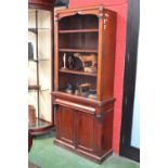 A Victorian mahogany bookcase, four shelves to top, projecting base,