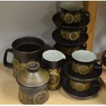 A Denby Arabesque pattern teapot, six teacups and saucers,