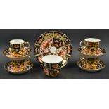 A Royal Crown Derby Imari 2451 pattern teacup and saucer; three coffee cans and saucers; etc.