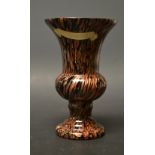 A 20th century Aventurina glass urn, decorated in black with chestnut filigrana, circular foot,