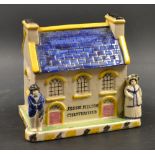 A Staffordshire Pearlware type money box, modelled as a cottage, with arched windows,