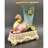 A French porcelain cornucopia and griffin vase, turquoise body painted with flowers,