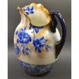 A Doulton Burslem Flow Blue dressing table wash jug decorated with flowers