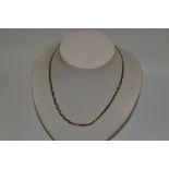 A lady's 9ct gold tri-colour necklace,  8.