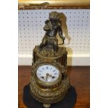 A French Second Empire bronze mantel clock, the enamel dial with blue painted Roman chapter, pierced