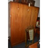 A mid 20th century teak bedroom suite, comprising chest, dressing table, bed end,