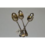 A George III Old English pattern table spoon, London ;  another;  a Fidle paten table spoon,