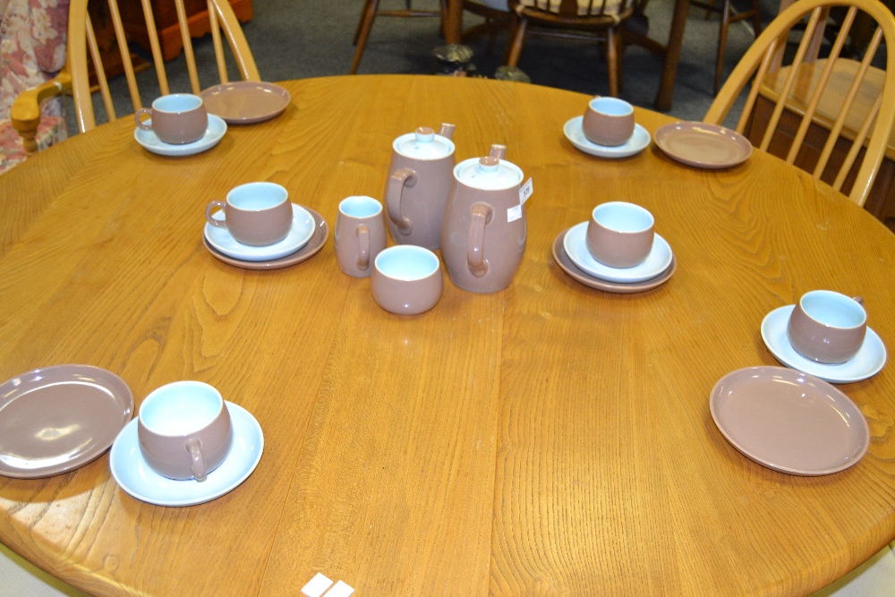 A Langley six-setting coffee service, chocolate ground with powder blue interior,