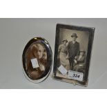 A silver oval photograph frame, 12cm x 8cm,.