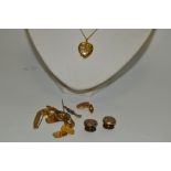 A 12ct rolled gold heart-shaped locket and chain, boxed; an Edwardian stick pin,