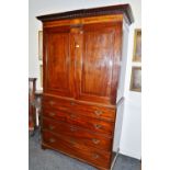 An unusual early George III mahogany linen press,