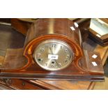 An Edwardian mahogany Napoleon hat mantel clock, inlaid in coloured woods, c.